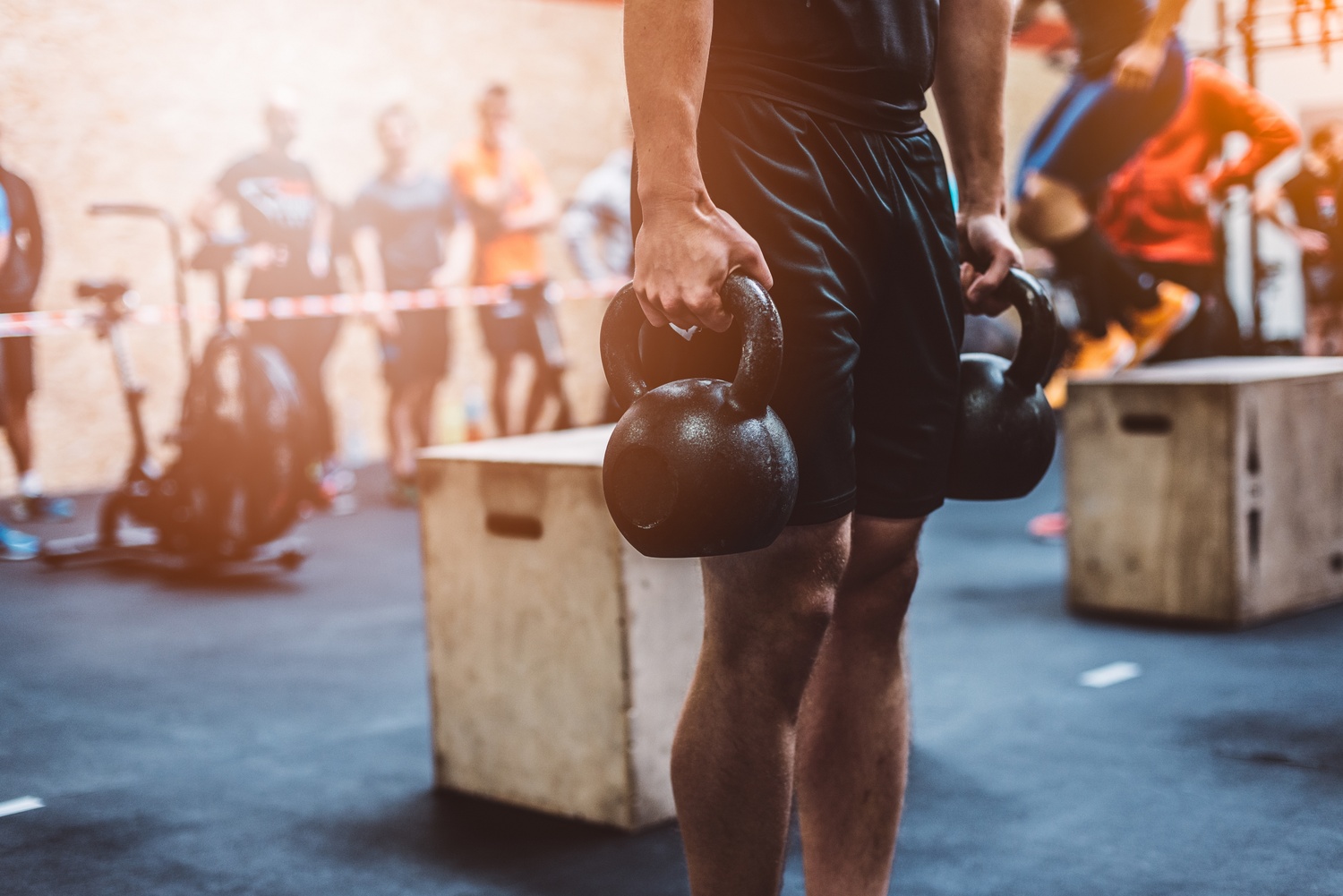 What is Functional Strength Training - man in gym holding kettlebell